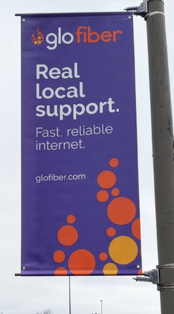 Glo Fiber logo and branding on light pole